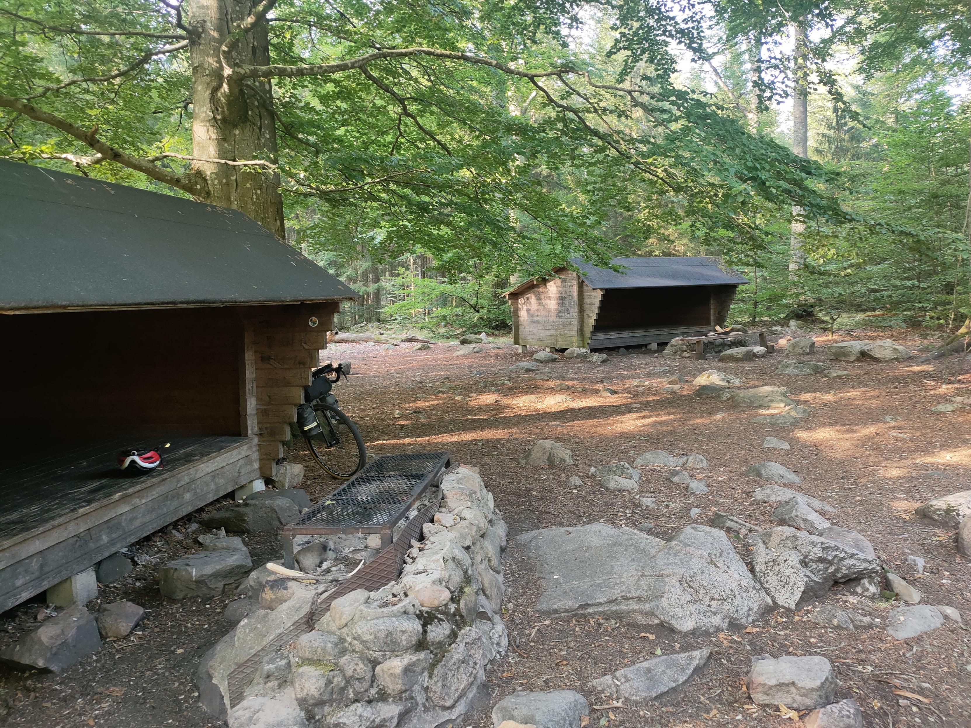 Photo of two shelters with 3 walls that can accommodate up to 6 people.